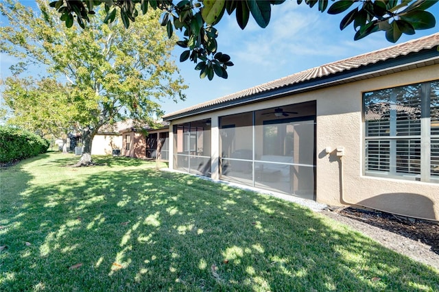 view of yard with a sunroom