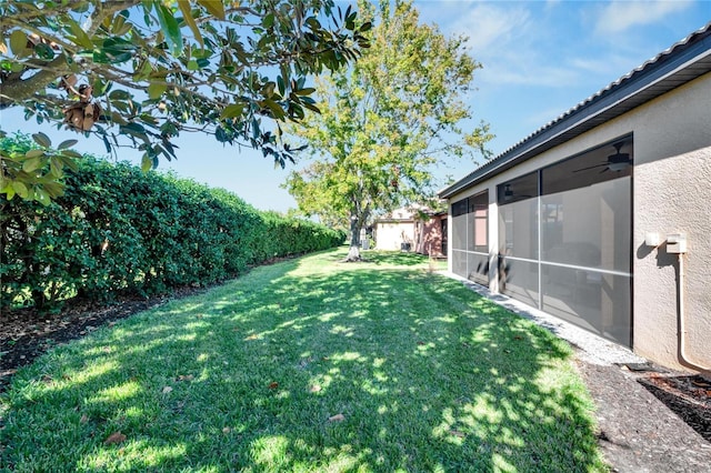 view of yard with a sunroom