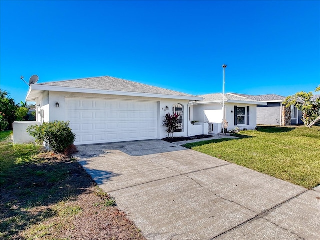 ranch-style house with a front yard and a garage