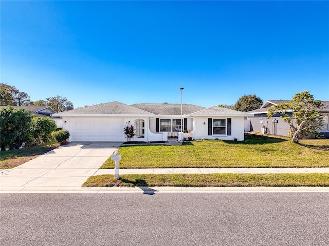 single story home featuring a front yard and a garage