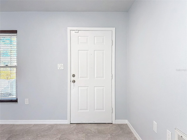 interior space featuring light tile patterned flooring