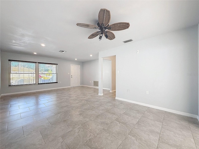 unfurnished room with ceiling fan