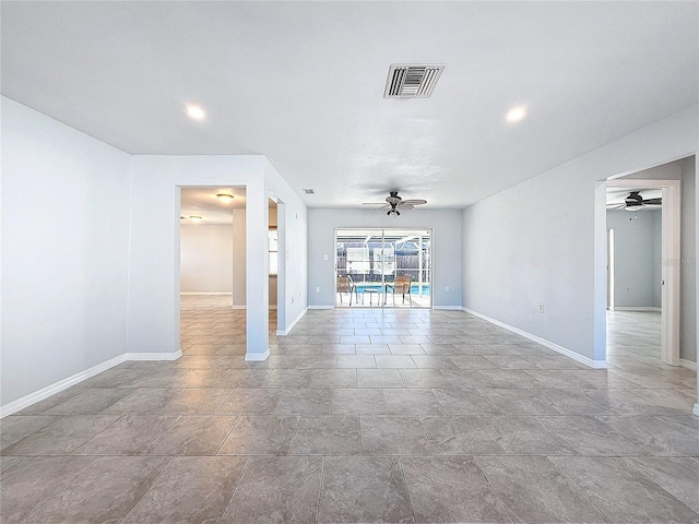 unfurnished living room with ceiling fan