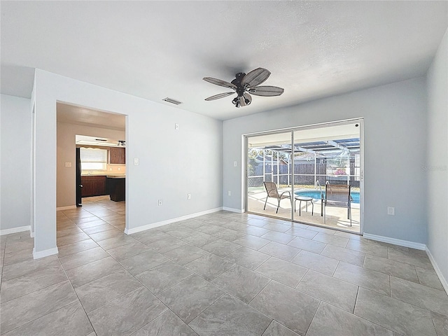 empty room featuring ceiling fan