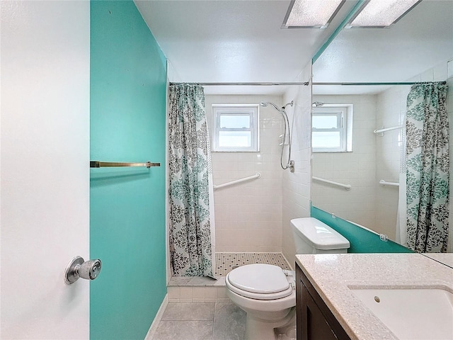 bathroom featuring curtained shower, tile patterned flooring, vanity, and toilet