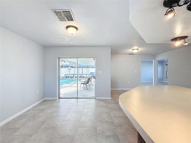 interior space featuring light tile patterned floors