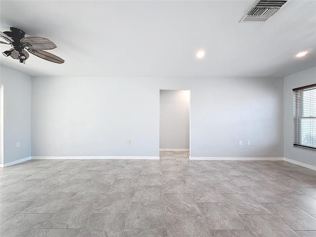 spare room with ceiling fan