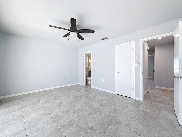 unfurnished bedroom with connected bathroom and ceiling fan