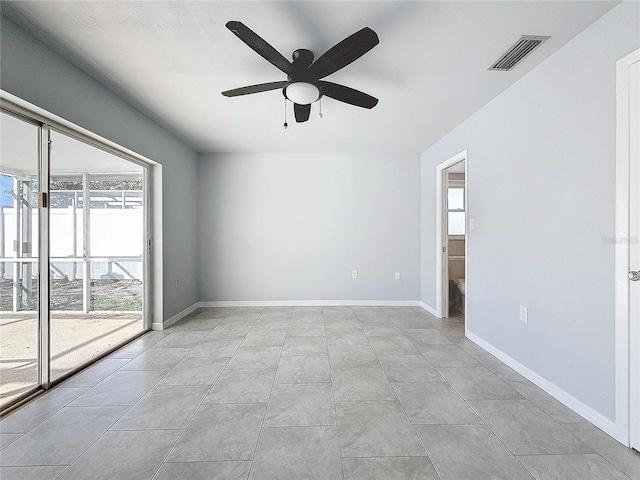 empty room featuring ceiling fan and light tile patterned floors