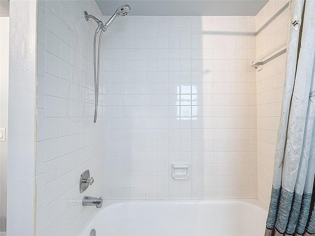 bathroom featuring shower / bath combo with shower curtain