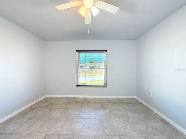 unfurnished room with light tile patterned floors and ceiling fan