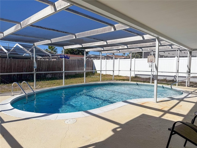 view of pool featuring a lanai and a patio