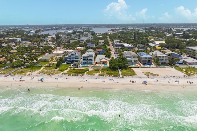 drone / aerial view with a water view and a beach view