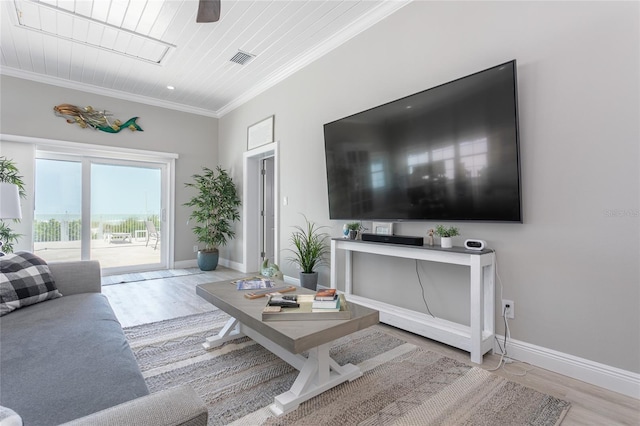 living room with ceiling fan, light wood-type flooring, wood ceiling, and crown molding