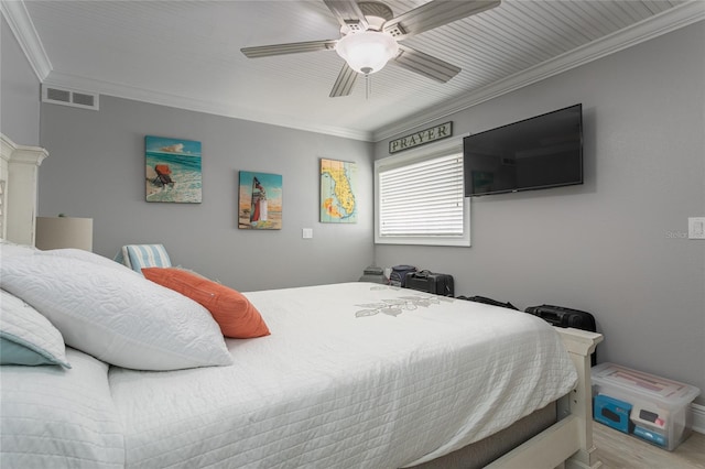 bedroom featuring ceiling fan and ornamental molding