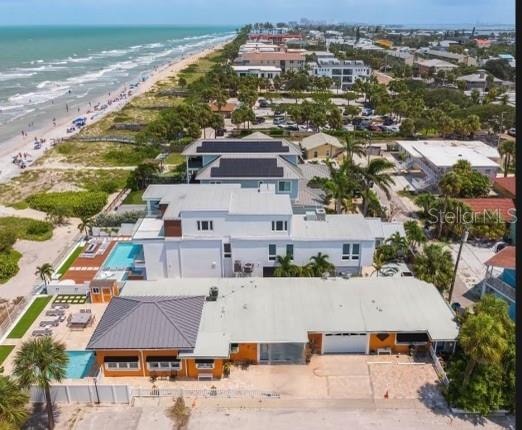 aerial view with a beach view and a water view