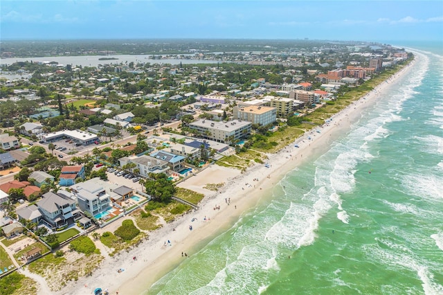 bird's eye view featuring a water view and a beach view