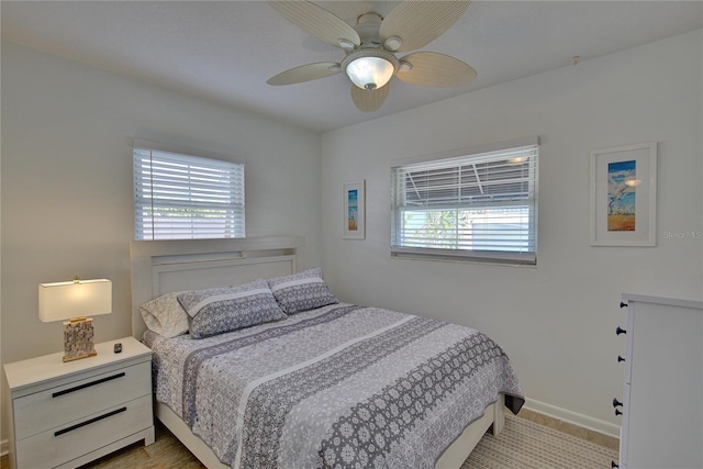 bedroom featuring light wood-type flooring and ceiling fan