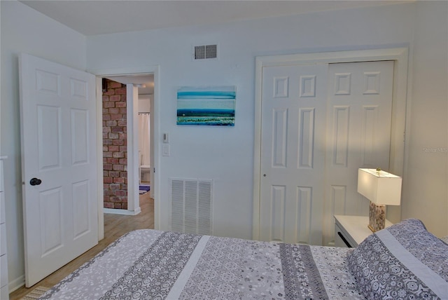 bedroom featuring light wood-type flooring and a closet