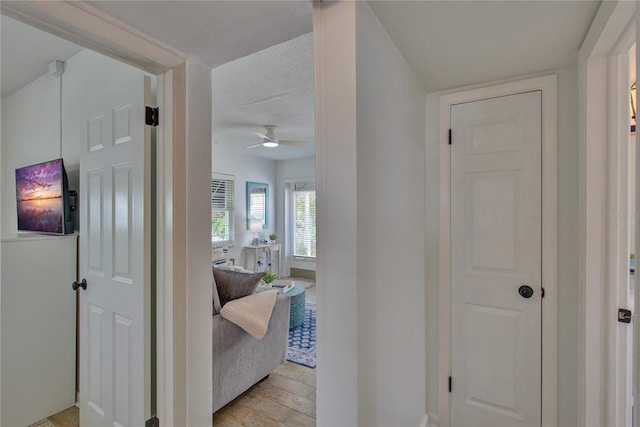 hallway featuring a textured ceiling