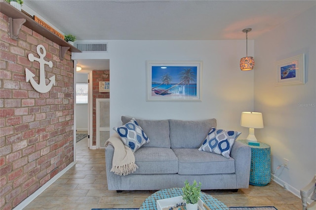 living room with brick wall