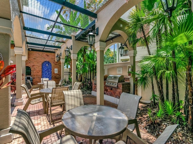 view of patio / terrace with area for grilling, a pergola, and grilling area