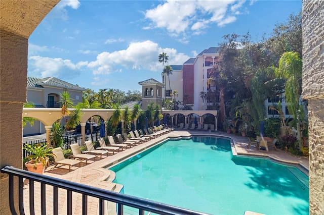 view of swimming pool featuring a patio area