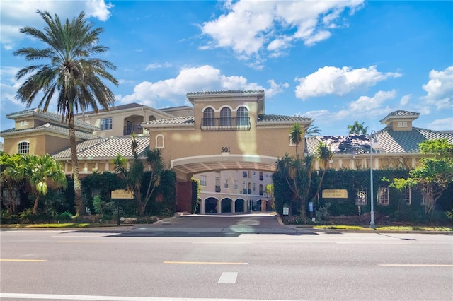 mediterranean / spanish house with a garage