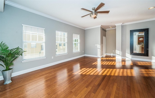 spare room with dark hardwood / wood-style flooring, ceiling fan, and ornamental molding