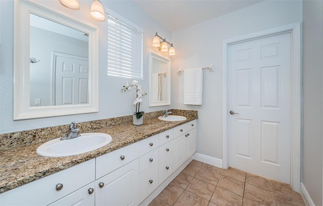 bathroom featuring tile patterned flooring and vanity