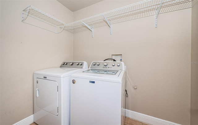 laundry area with washing machine and dryer