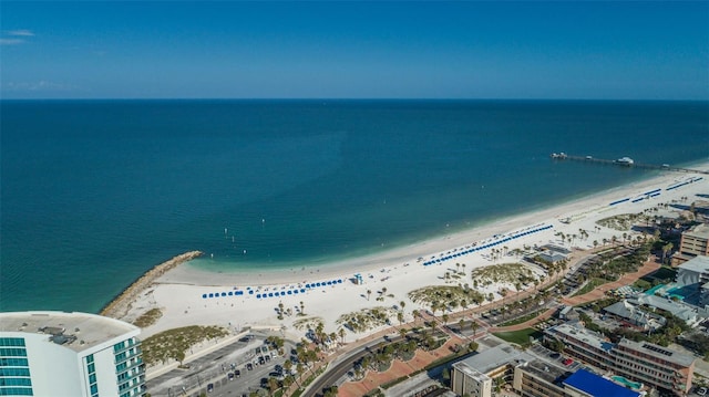 birds eye view of property featuring a water view and a beach view