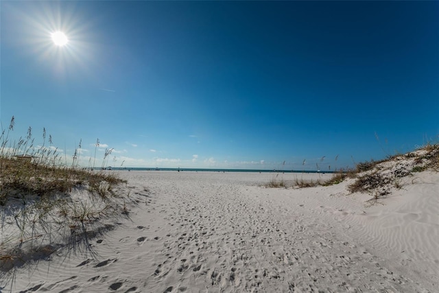 property view of water featuring a beach view