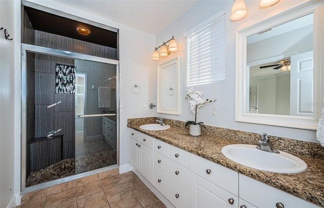 bathroom featuring ceiling fan, tile patterned flooring, vanity, and a shower with shower door