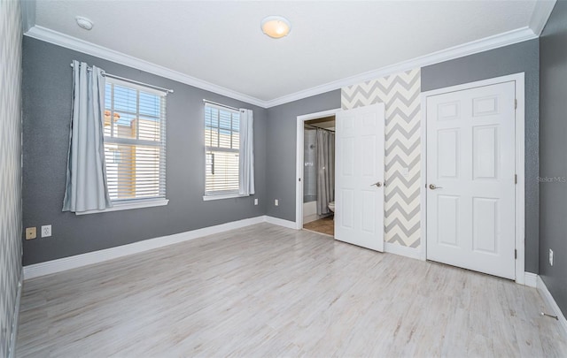 unfurnished bedroom with crown molding and light hardwood / wood-style flooring