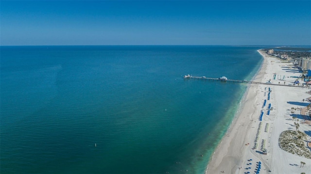 bird's eye view featuring a water view and a beach view