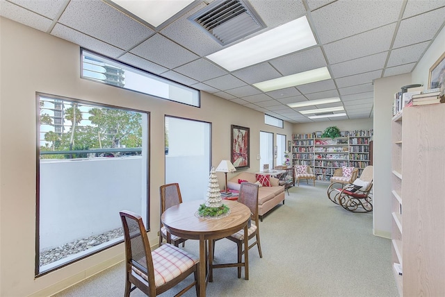 dining area featuring light colored carpet