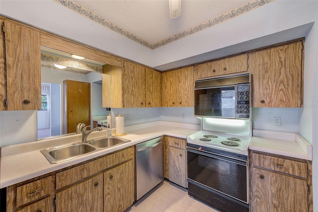 kitchen with stainless steel dishwasher, electric range oven, sink, and a textured ceiling