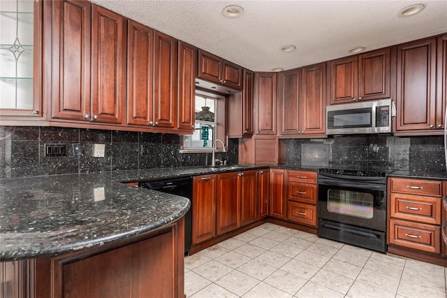 kitchen featuring sink, tasteful backsplash, dark stone counters, light tile patterned flooring, and black appliances