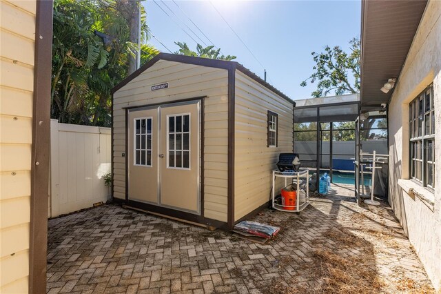 view of outbuilding featuring a fenced in pool