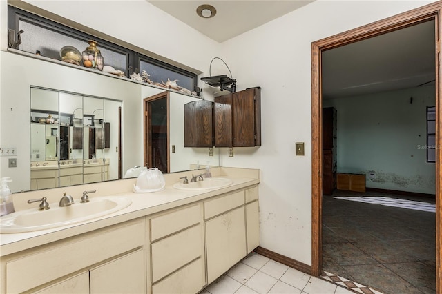 bathroom with vanity and tile patterned floors