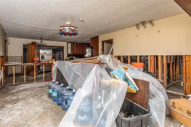 interior space with a textured ceiling