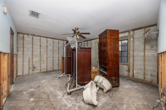 interior space featuring ceiling fan