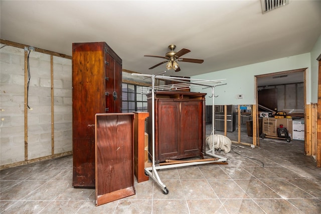 interior space featuring ceiling fan