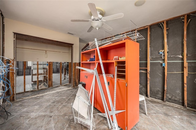 interior space featuring ceiling fan