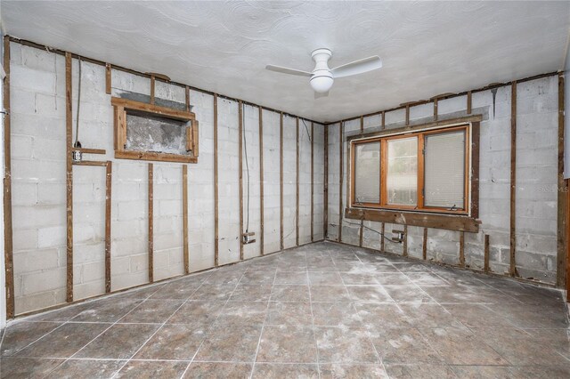 interior space featuring ceiling fan