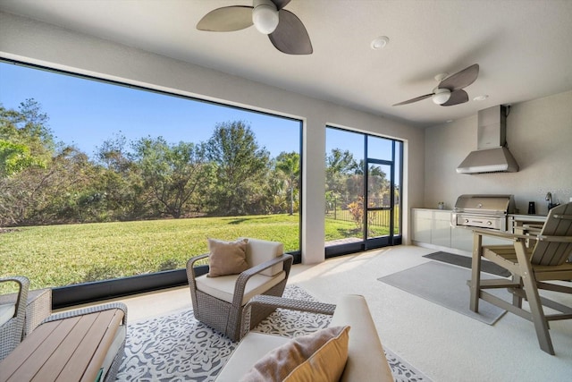 sunroom / solarium with ceiling fan