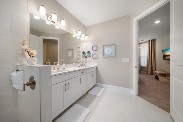 bathroom with tile patterned floors and vanity