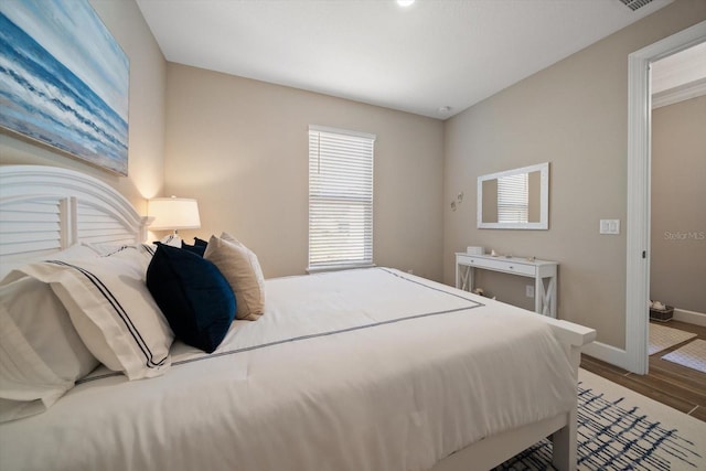 bedroom featuring wood-type flooring