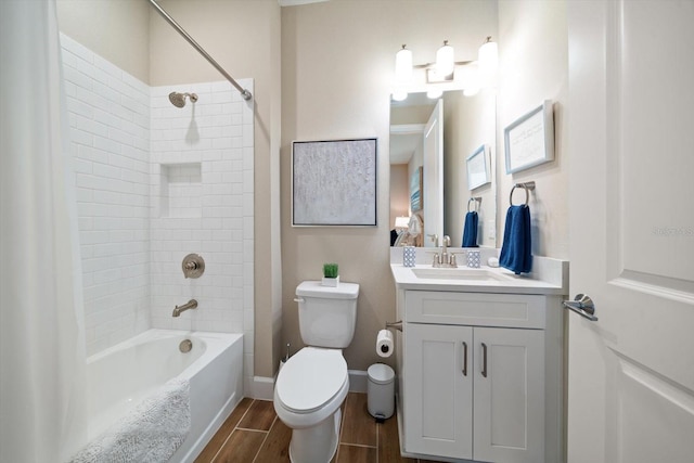 full bathroom featuring vanity, toilet, and tiled shower / bath